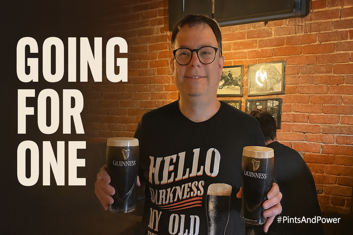 The author holding two Guinness pints smiling. Headline reads “Going for “One”